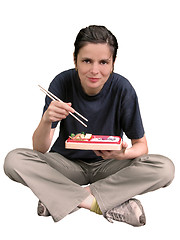 Image showing Woman eating Asian food