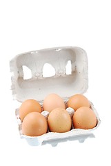 Image showing Six brown eggs packed in a carton box