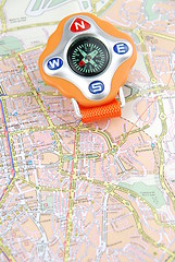 Image showing Travel concept with a compass on a map