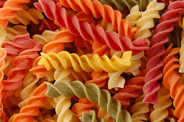 Image showing multi colored twirls pasta background