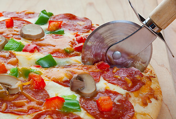 Image showing Cutting The Pizza