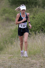 Image showing Woman running with a cap