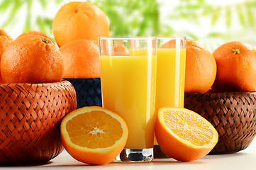 Image showing Glasses of orange juice and fruits