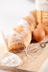 Image showing bread, flour, eggs and kitchen utensil