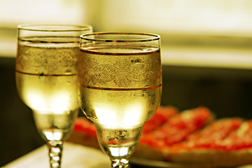 Image showing champagne glasses and red caviar