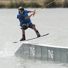 Image showing Young boy rides his wakeboard