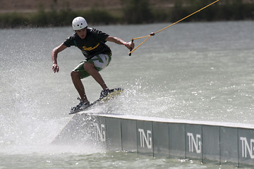 Image showing Man rides his wakeboard