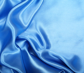 Image showing Smooth elegant blue silk as background 