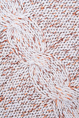 Image showing White, brown and orange knitted textured as background 