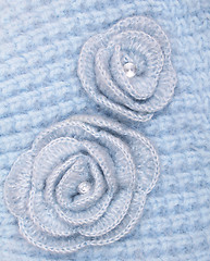 Image showing Blue wool flowers on a blue wool background 