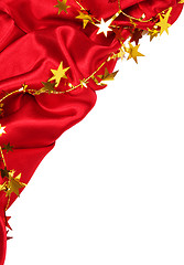 Image showing Smooth Red Silk with golden stars as holiday background 