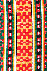 Image showing Red, yellow and green knitted textured as background 