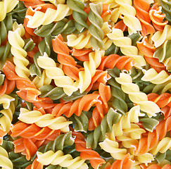 Image showing Uncooked italian pasta - three colors spirals