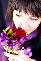 Image showing woman with purple and red flowers