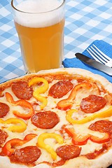 Image showing Hot spicy pizza and beer