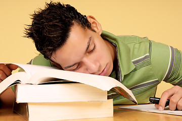 Image showing Student sleeping on books