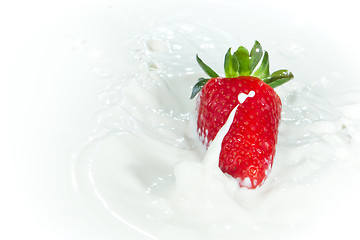 Image showing strawberry splashing into milk