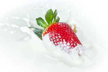 Image showing strawberry splashing into milk