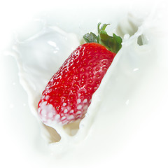 Image showing strawberry splashing into milk