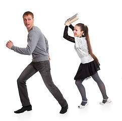 Image showing Girl with a book in her hands ran over boyfriend