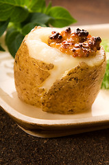 Image showing Baked potato with sour cream, grain Dijon mustard and herbs