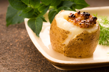 Image showing Baked potato with sour cream, grain Dijon mustard and herbs