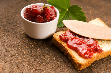 Image showing Wild strawberry jam with toast