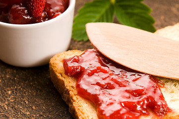 Image showing Wild strawberry jam with toast