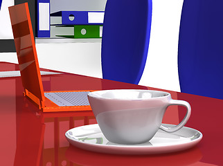 Image showing Cup on the office desk near laptop