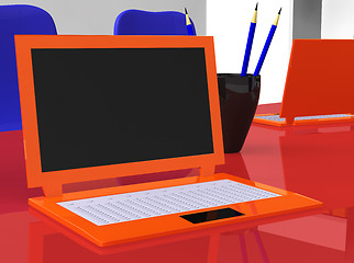 Image showing stereoscopic laptops on red table with pencils