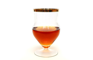 Image showing Glass with cognac standing on white background