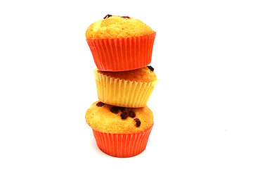 Image showing Tasty yellow three muffins on each other