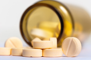 Image showing Pills on isolated white background with bottle