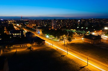 Image showing Night shot of a busy city with apartments and lights