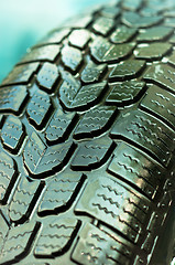 Image showing Wet car tire texture in green and blue colors