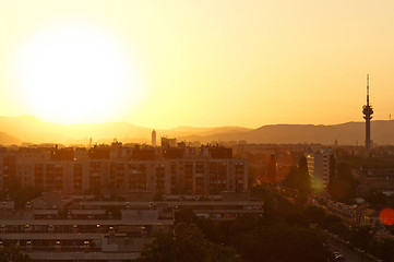 Image showing Sunset at suburbs with the shiolhouettes of the city