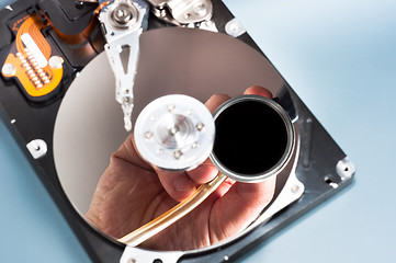 Image showing Doctor inspecting bad hdd