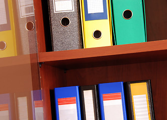 Image showing Colorful files in office shelf