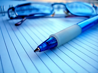 Image showing pencil and glasses in blue