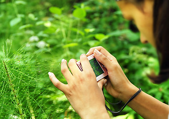 Image showing Teenage girl with a camera