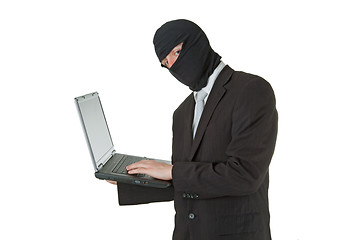 Image showing Man stealing data from a laptop
