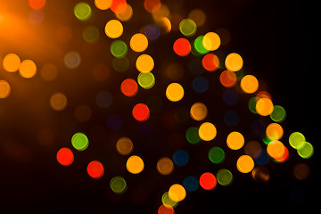 Image showing Festive colorful lights over black