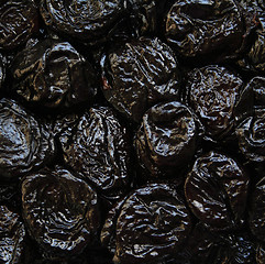 Image showing Dry plums or prunes fruit as background 