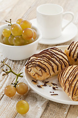 Image showing chocolate croissants, grapes and coffee