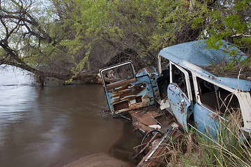 Image showing junk cars on river