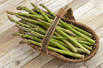 Image showing green asparagus in wicker basket