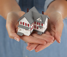 Image showing Woman Holding Model Home in Hands