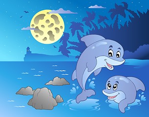 Image showing Night seascape with happy dolphins