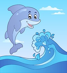 Image showing Jumping dolphin with cartoon wave 1
