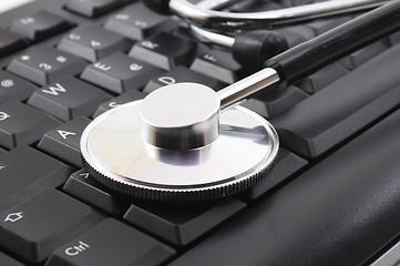 Image showing stethoscope on computer keyboard